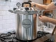 All American 930 pressure canner heating on stove