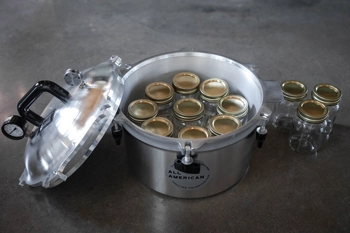 Inside view of All American 915 canner with pint jars loaded.