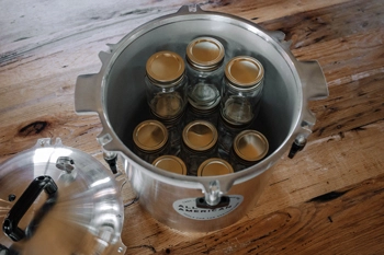 Inside view of All American 925 canner with pint jars loaded.